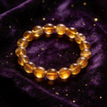 Amber natural stone bracelet on dark velvet