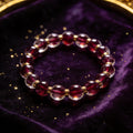 Garnet natural stone bracelet on dark velvet