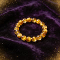 Golden Tiger Eye natural stone bracelet on dark velvet