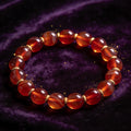 Red Agate natural stone bracelet on dark velvet