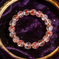 Strawberry Quartz natural stone bracelet on dark velvet
