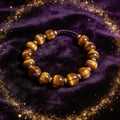 Tiger Eye natural stone bracelet on dark velvet